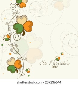 Elegant greeting card design with clover leaves in Irish Flag colors for Happy St. Patrick's Day celebration.