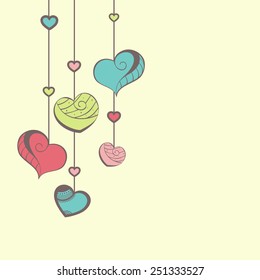 Elegant greeting card design with colorful hanging hearts for Happy Valentines Day celebration.