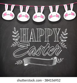 Elegant greeting card design decoarted with stylish text Happy Easter, blank ribbon and cute hanging bunnies on chalkboard background.