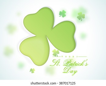 Elegant greeting card design with glossy shamrock leaves for Happy St. Patrick's Day celebration.