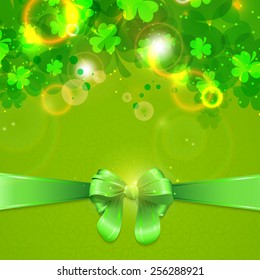 Elegant greeting card design with shamrock leaves and glossy green ribbon for Happy St. Patrick's Day celebration.