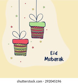 Elegant greeting card with stylish hanging gifts boxes on stars decorated background for holy Islamic festival, Eid celebration.