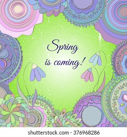 Elegant hand drawn doodle spring frame with text. Spring is coming. Square doodle frame with circles and snowdrops in light and fresh colors.