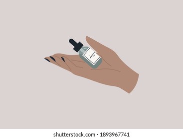 An elegant hand holding a bottle of beauty serum, skin care daily routine