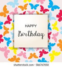 Elegant Happy Birthday calligraphy design over cut paper frame. Abstract background of bright colored flying butterflies. Greeting card, postcard or invitation design template. Vector illustration