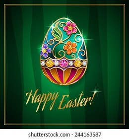 Elegant jewelry Easter egg on green background 