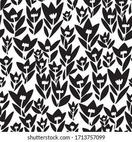 Elegant laconic tulip flowers silhouette seamless pattern in black and white color for background, fabric, textile, wrap, surface, web and print design. Vector decorative spring floral BW tile rapport