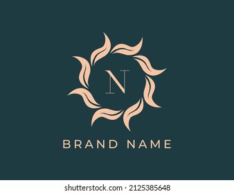 Elegant Leaf Flower Emblem Logo with Letter N. Vector logo template