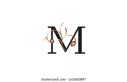Elegant letter M in black with a botanical metallic element. Vector logo design. Alphabet label sign for brand and identity.
