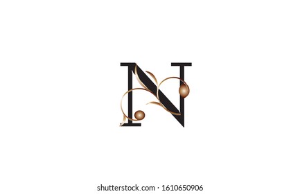 Elegant letter N in black with a botanical metallic element. Vector logo design. Alphabet label sign for brand and identity.