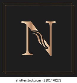 Elegant letter N Graceful Royal Calligraphic Beautiful Logo. Vintage Gold Drawn Emblem for Book Design, Brand Name, Business Card, Restaurant, Boutique, or Hotel
