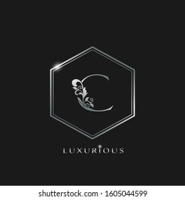 Elegant Luxurious Initial Letter C logo icon vector design. Silver color logo hexagon geometric shape with floral leaf letter icon.