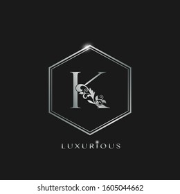 Elegant Luxurious Initial Letter K logo icon vector design. Silver color logo hexagon geometric shape with floral leaf letter icon.