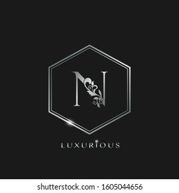 Elegant Luxurious Initial Letter N logo icon vector design. Silver color logo hexagon geometric shape with floral leaf letter icon.