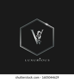 Elegant Luxurious Initial Letter V logo icon vector design. Silver color logo hexagon geometric shape with floral leaf letter icon.
