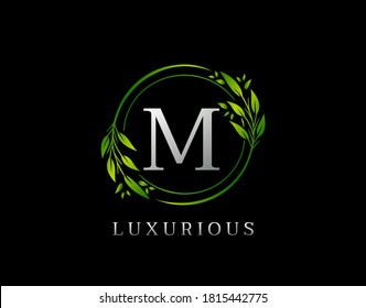 Elegant M Letter Green Floral Design. Circle Green Leaf M Logo Icon.