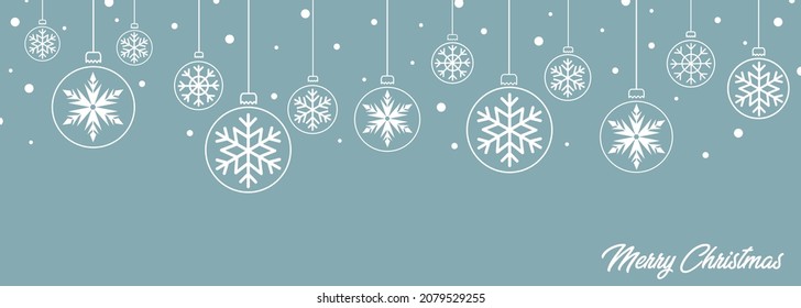 Elegant and modern card with Christmas balls with snowflakes of different sizes, round, white with congratulations and snow on a light blue background