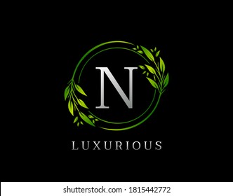Elegant N Letter Green Floral Design. Circle Green Leaf N Logo Icon.