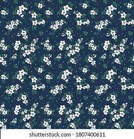 Elegant pattern in small flowers. Liberty style. Floral seamless background. Ditsy print. Vector texture. A bouquet of spring flowers for fashion prints.