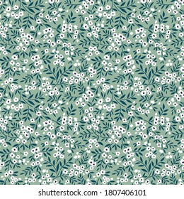 Elegant pattern in small flowers. Liberty style. Floral seamless background. Ditsy print. Vector texture. A bouquet of spring flowers for fashion prints.
