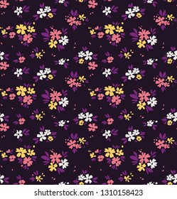 Elegant pattern in small flowers are scattered on the surface. Liberty style. Floral seamless background. Ditsy print. Vector texture. A bouquet of spring flowers for fashion prints.