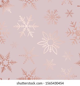 Elegant rose gold glitter snowflakes tile seamless pattern. Delicate winter background. Beautiful texture abstract snow backdrop. Falling snowflakes for design wallpaper, wrapping paper, wrapper