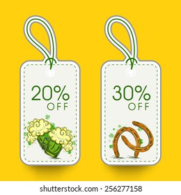 Elegant sale tags with beer mug, horseshoe and discount offer of 20% and 30% for Happy St. Patrick's Day celebration.