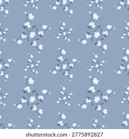 Elegant seamless floral pattern featuring delicate white blossoms and soft branches on a muted blue background. Perfect for wallpaper, textiles, packaging, and digital design. Minimal, calming, and timeless style suitable for modern and classic decorative projects.