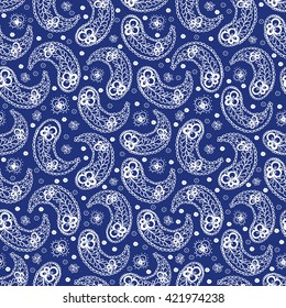 Elegant seamless pattern with abstract hand drawn flowers and paisley. Blue and white