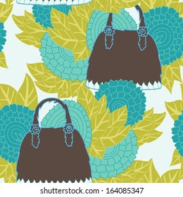 elegant seamless pattern with decorative woman handbags with abstract blue flowers on background