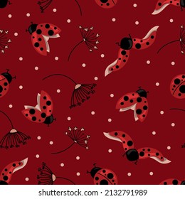 Elegant seamless pattern with flying ladybugs and dried flowers on burgundy background