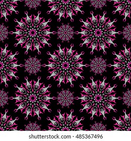 Elegant seamless pattern with Mandala and floral elements.Nice hand-drawn illustration