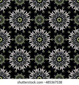 Elegant seamless pattern with Mandala and floral elements.Nice hand-drawn illustration