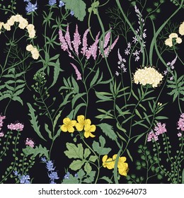 Elegant seamless pattern with trendy wild flowers and herbaceous flowering plants on black background. Beautiful floral backdrop. Colorful vector illustration for textile print, wallpaper.