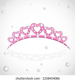 Elegant shiny pink tiara in heart shape with precious stones isolated on white background