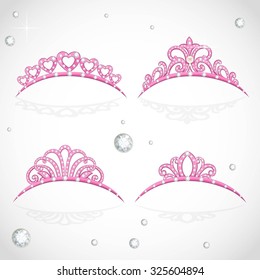 Elegant shiny pink tiara with precious stones isolated on white background