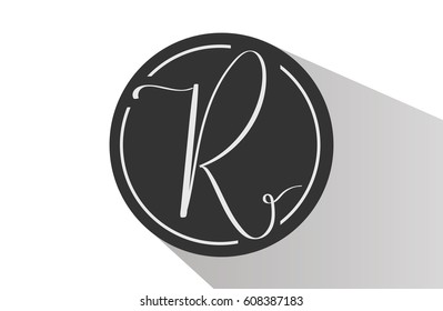 Elegant sophisticated logo design. Hand written calligraphy letter R in a circle.