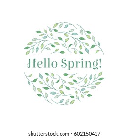 Elegant tree branches arranged in a circle with a "Hello Spring!" inscription. Seasonal spring concept in delicate green hues.