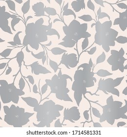 Elegant vector repeat pattern with silver silhouettes of magnolia flowers, leaves and branches.