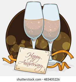 Elegant view of a pair of wine glasses with golden streamers and greeting card for the Anniversary party in a bokeh background.