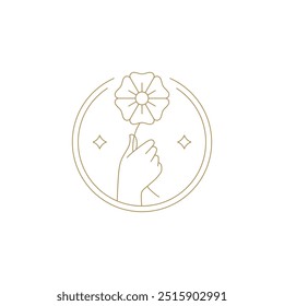 Elegant woman hand holding natural flower in circle frame golden line art icon vector illustration. Beautiful floral blossom herb with petals and stem in arm luxury emblem for organic cosmetic