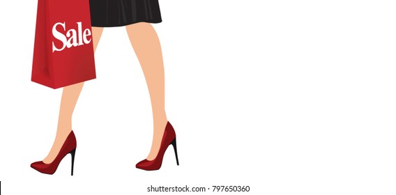 Elegant woman legs with red high heels holding a sale shopping bag