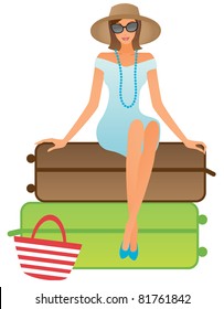Elegant woman sitting on suitcases