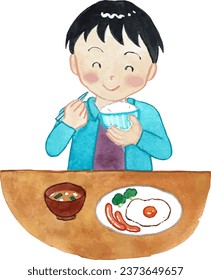 Elementary school boy eating breakfast