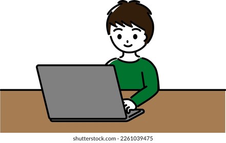 Elementary school boy operating a laptop with a smile