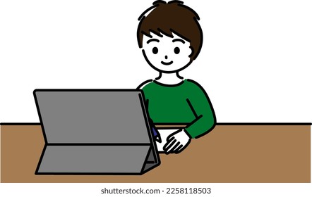 Elementary school boy studying with a tablet with a smile