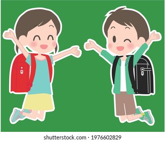 Elementary school boys and girls who carry school bags on their backs and jump with a smile