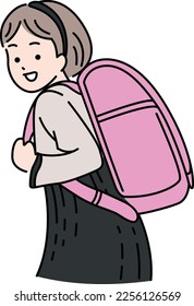 Elementary school student carrying a school bag