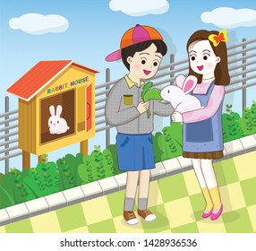 Elementary school students feeding rabbits during their hands-on activities.
