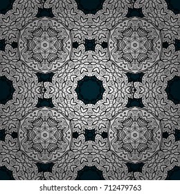 Elements on blue background. Damask pattern repeating background. Antique white repeatable wallpaper. White white floral ornament in baroque style.